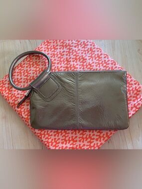 HOBO Metallic Bronze Wristlet Clutch with Circular Handle